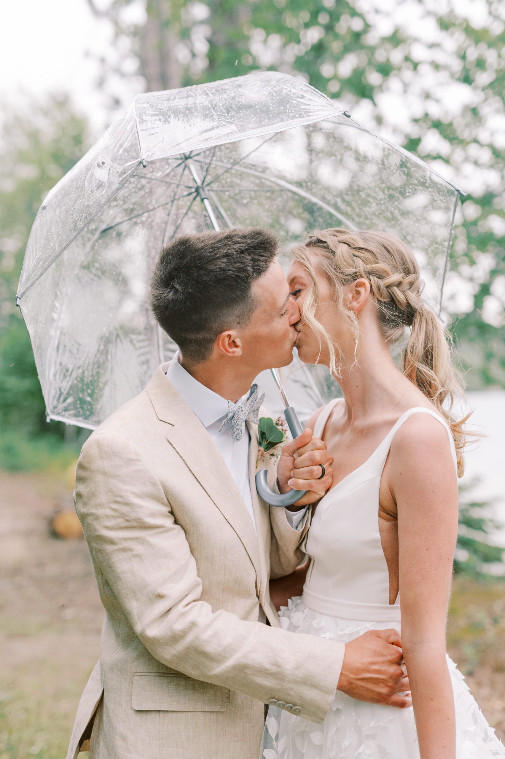 bride and groom portrait under umbrella