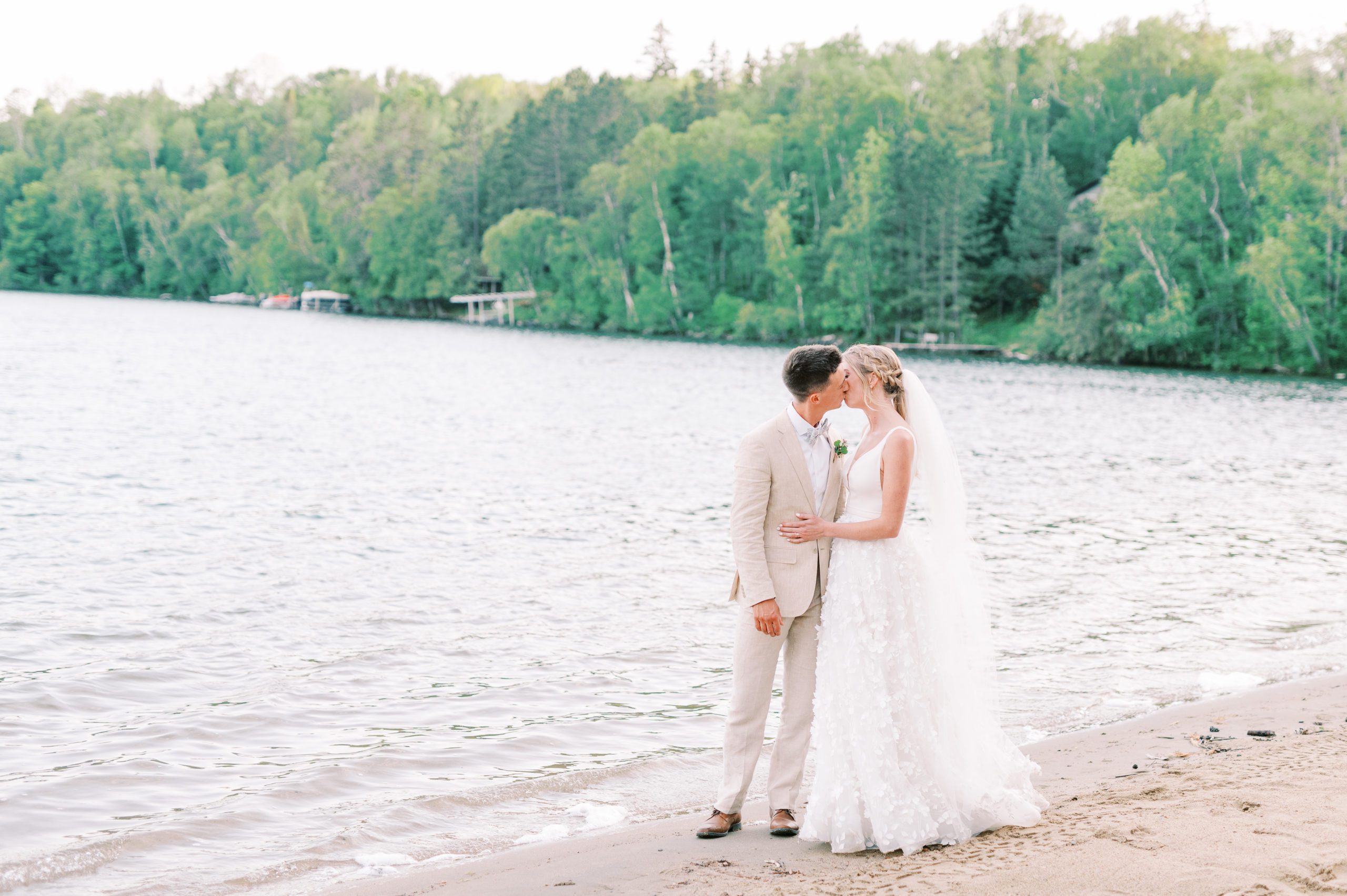 bride and groom portrait kiss on beach