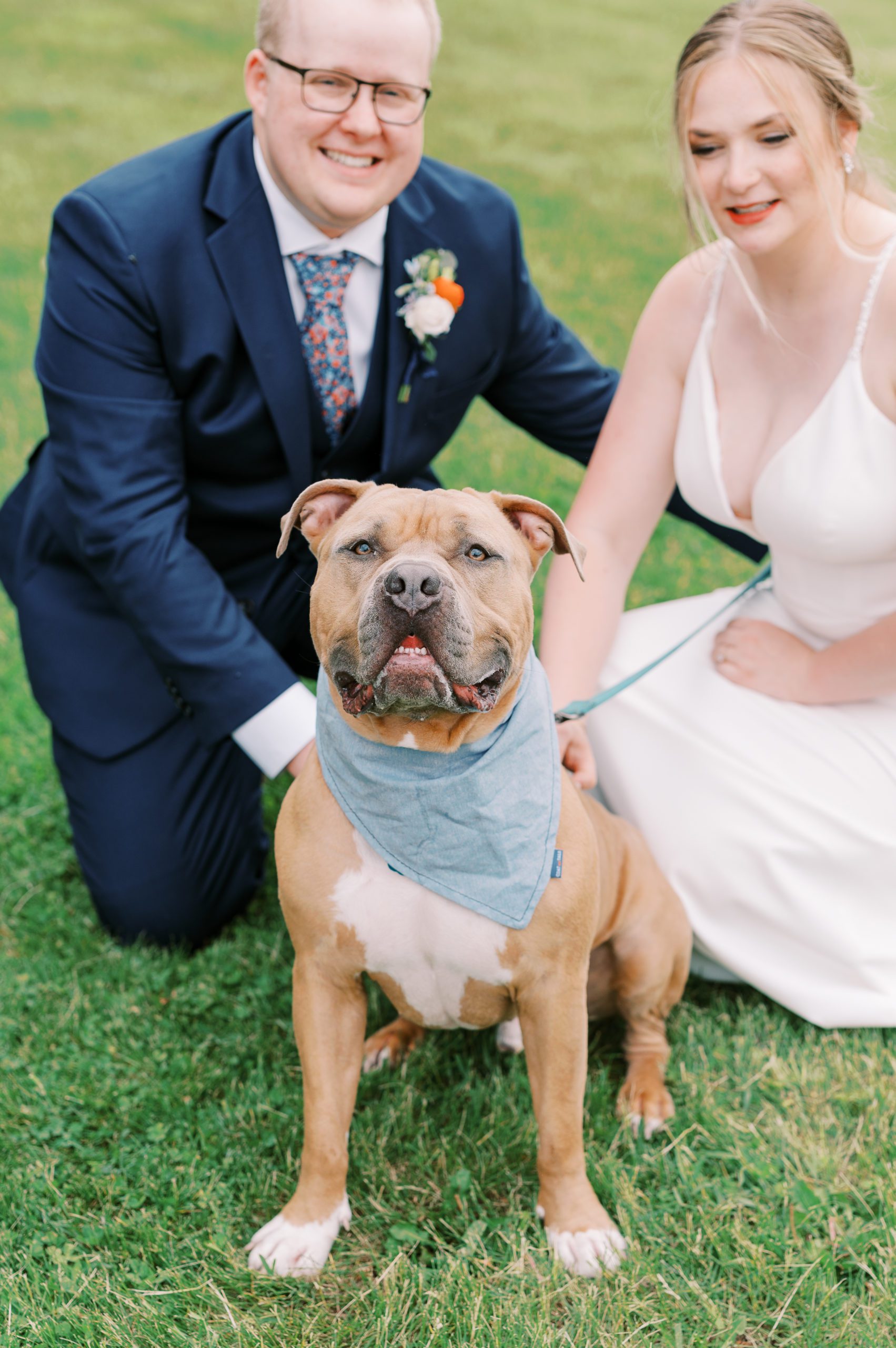 bride and groom with pup in minnesota