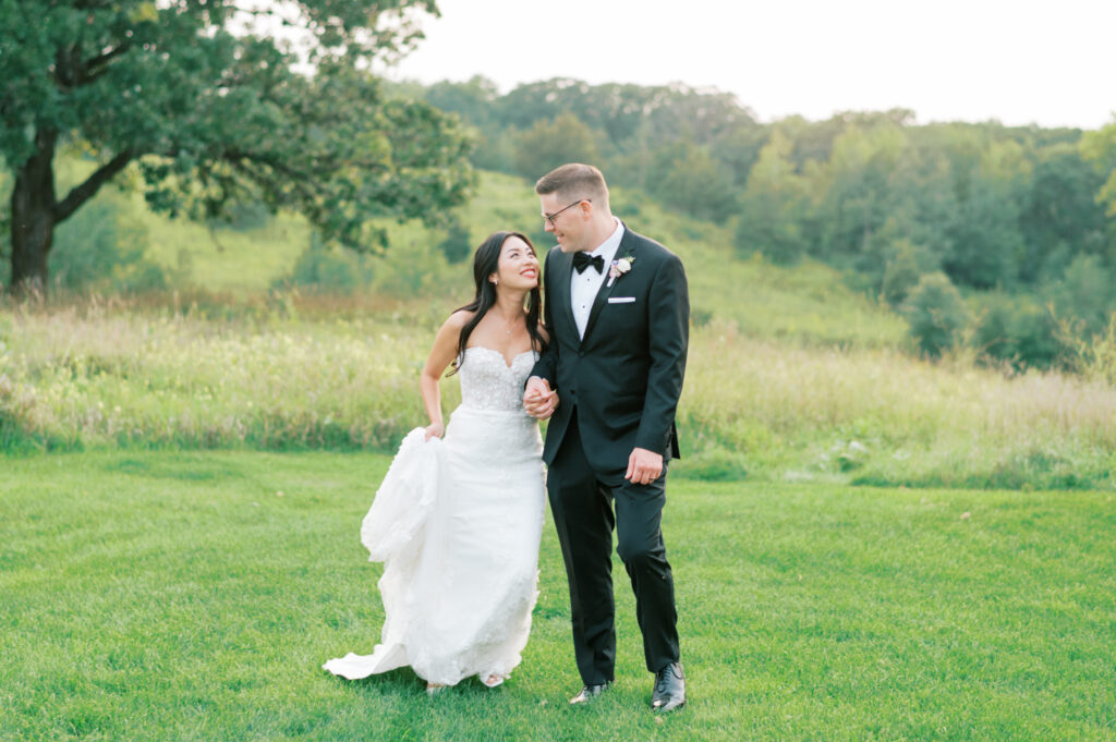 Couple walking together at a beautiful southern Minnesota wedding.